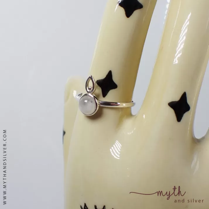 Silver moonstone ring on ceramic hand