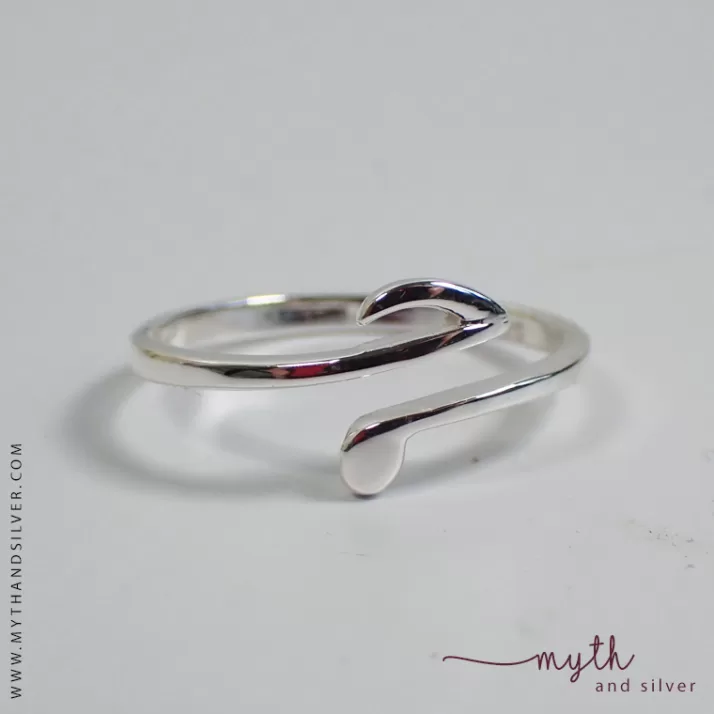 Close up of sterling silver music note ring